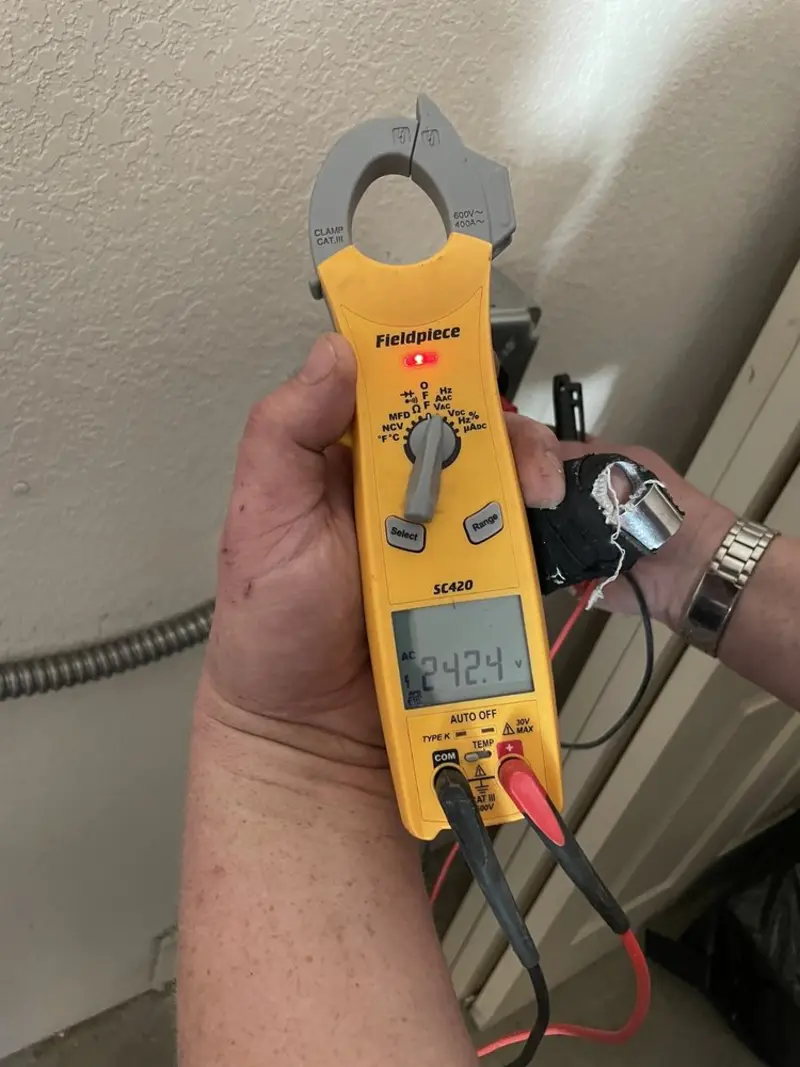 Voltage testing with clamp meter during Electrical Installation Services in Cambria